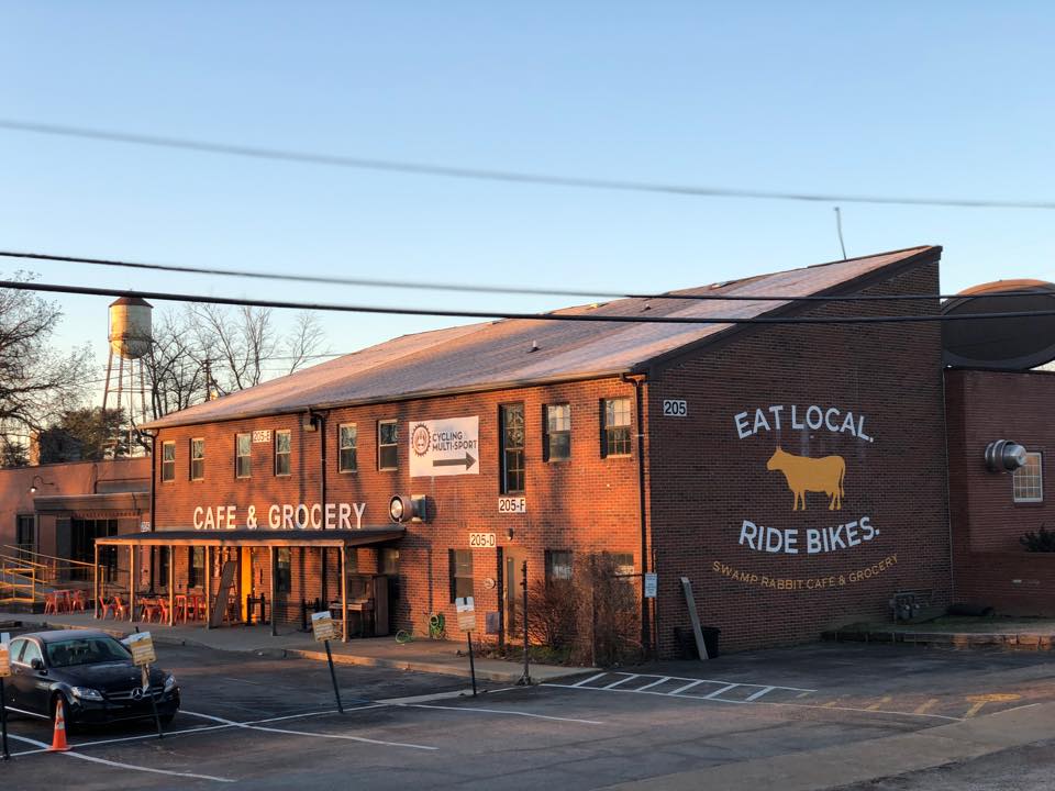 Family enjoying time at Swamp Rabbit Cafe with rabbits